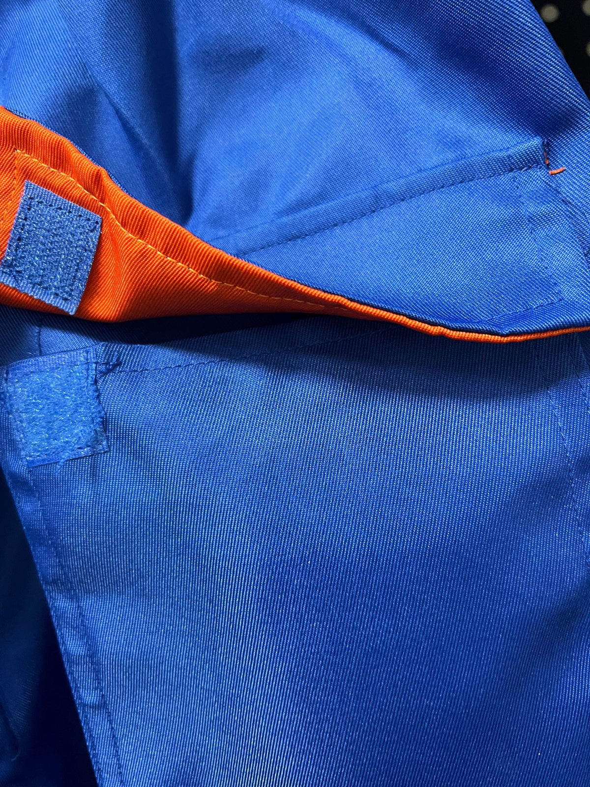 Blue coverall flap pocket with orange lining