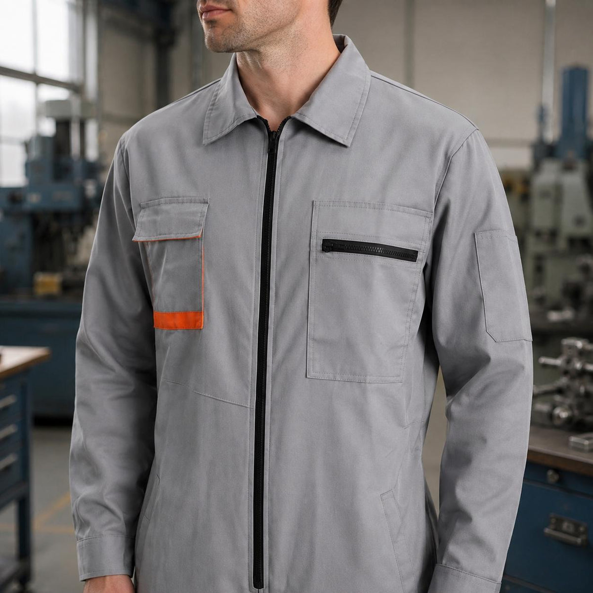 Light gray work coverall front with black zipper and orange pocket accent