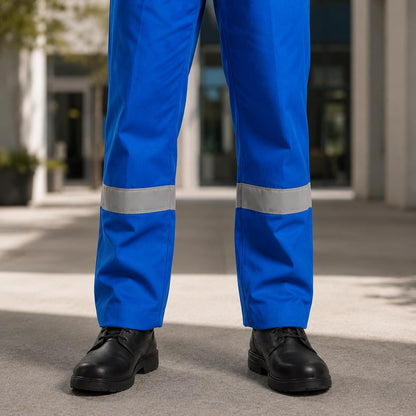 Bright-blue trousers and reflective lower-leg bands.